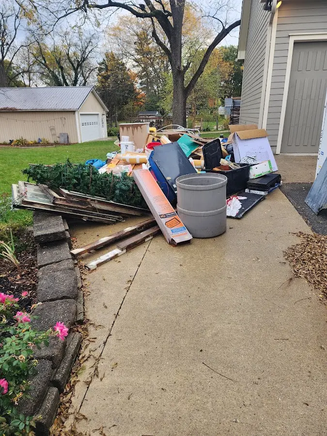 Dumpster being loaded with debris for Residential Dumpster Rental in Strasburg